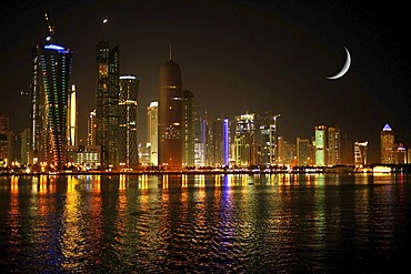 Night shot, skyline of Doha, Tornado Tower, Navigation Tower, Peace Towers, Al-Thani Tower, Moon, Doha, Qatar, Qatar, Persian Gulf, Middle East, Asia