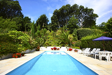 Swimming pool, holiday cottages, Mille Fleurs Garden, garden landscape, St. Peter's, Guernsey, Channel Islands, Europe