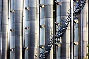 Steep stairs leading up stainless steel tanks, chemical industry, storage tanks for chemical products, Germany, Europe