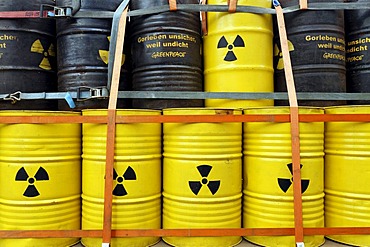 Symbolic nuclear waste barrels stacked on a loading platform, anti-nuclear demonstration against the Gorleben disposal site, Lueneburg, Lower Saxony, Germany, Europe