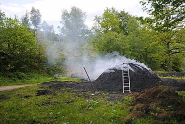 Burning charcoal kiln, Walpersdorf, Siegen-Wittgenstein region, North Rhine-Westphalia, Germany, Europe