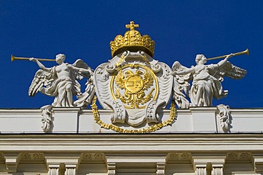 Sculptures with the imperial crown and coat of arms on the roof of the Hofburg Imperial Palace, Vienna, Austria, Europe