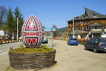 Oversized Easter egg as a sign to the Moldova convent, Vorone& Monastery, Eastern Carpathians, Romania, Europe