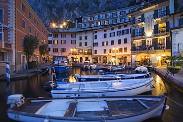 Illuminated promenade at the port of Limone in the evening, Lake Garda, Lombardy, Italy, Europe