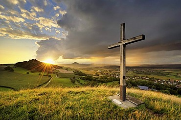 Evening mood in the Hegau, Mt. Maegdeberg with the setting sun on the horizon, Landkreis Konstanz county, Baden-Wuerttemberg, Germany, Europe