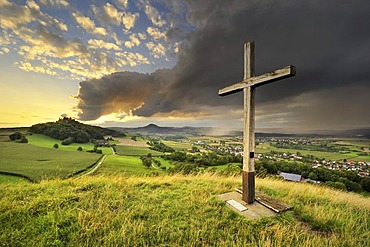 Evening mood in the Hegau, Mt. Maegdeberg with the setting sun on the horizon, Landkreis Konstanz county, Baden-Wuerttemberg, Germany, Europe