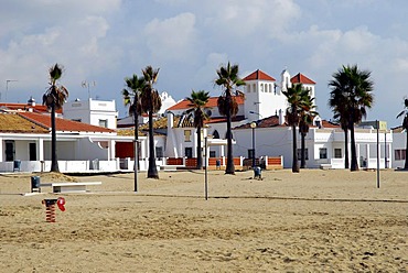 Promenade with church and palm trees on the beach, La Antilla, Lepe, Costa de la Luz, Huelva region, Andalusia, Spain, Europe