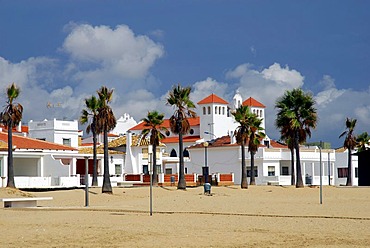 Alameda with church and palm trees on the beach, La Antilla, Costa de la Luz, Huelva region, Andalusia, Spain, Europe