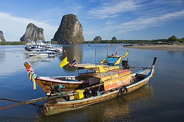 Karst rock formations and fishing boats in the Bay of Pakmeng, Trang, Thailand, Southeast Asia, Asia