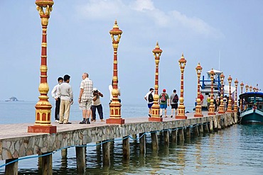 Tourists on the pier of Victory Beach, Sihanoukville, Cambodia, Indochina, Southeast Asia