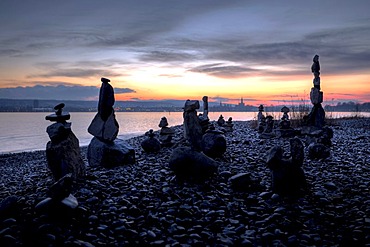 Cairns on the shores of Lake Constance, with the Cathedral of Constance in the evening light, Baden-Wuerttemberg, Germany, Europe