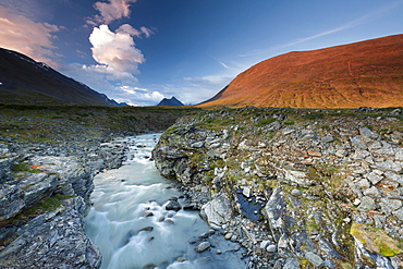 Midnight sun in the Fjaell Mountains with a stream along the Kungsleden, The King's Trail, Lapland, Sweden, Europe