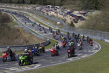 Several thousand motorcyclists in a motorcycle parade on the Nordschleife part of the Nuerburgring race track, begin of the motorcycle season with the motto "Anlassen", start, Rhineland-Palatinate, Germany, Europe