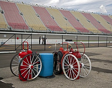 Fire extinguishers on wheels at Michigan International Speedway which features a two-mile race track and seats nearly 120, 000 fans for NASCAR races, Brooklyn, Michigan, USA, America