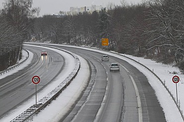 Snow covered B448 highway near Offenbach-Bieber with 120kmh speed limit signs, Hesse, Germany