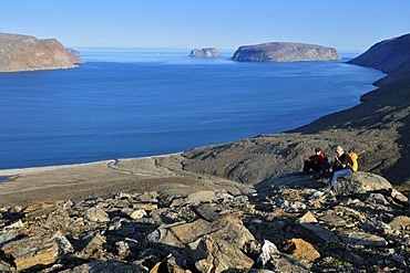 Hiker overlooking Sunnshine Fjord, Baffin Island, Nunavut, Canada, Arctic