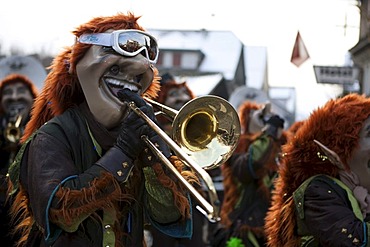 Guggenmusig Aemmerrugger group dressed to the theme of funny trolls during the carnival procession in Malters, Lucerne, Switzerland, Europe