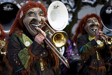 Guggenmusig Aemmerrugger group dressed to the theme of funny trolls during the carnival procession in Malters, Lucerne, Switzerland, Europe