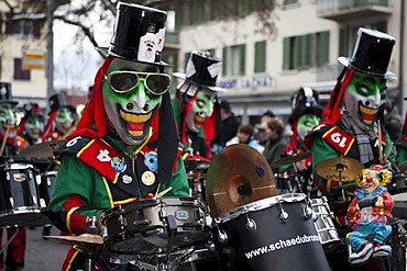 Guggenmusig Schaedubrommer group dressed to the theme of casino during the carnival procession in Malters, Lucerne, Switzerland, Europe