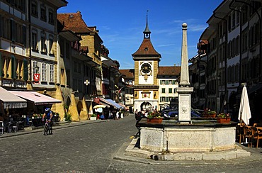 Main street and Bern Gate of the medieval city fortification in the historic centre of Murten, Morat, Switzerland, Europe