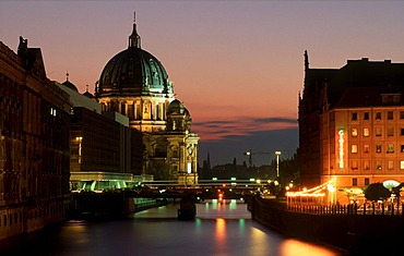 Berliner Dom cathedral with a red evening sky, Spree river, Nikolaiviertel quarter, Palast der Republik, Mitte district, Berlin, Germany, Europe