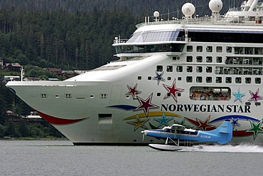 Cruise ship and seaplane in the harbour of Juneau, Alaska, USA