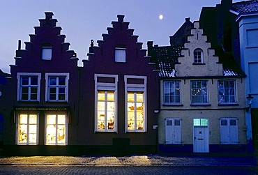 Medieval houses with stepped gables, illuminated windows, evening mood, romantic old town, Bruges, West Flanders, Belgium, Europe