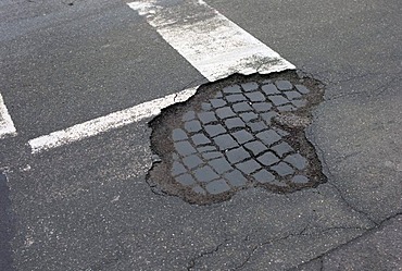 Frost damage, potholes in the road surface, Germany