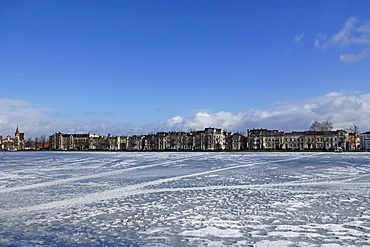 Frozen Pfaffenteich lake, in the back stately town mansions, August-Bebel-Strasse, Schwerin, Mecklenburg-Western Pomerania, Germany, Europe