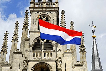 Stadhuis Gothic city hall at the market, national flag marking a public holiday or commemoration day, Gouda, Zuid-Holland, South Holland, The Netherlands, Europe