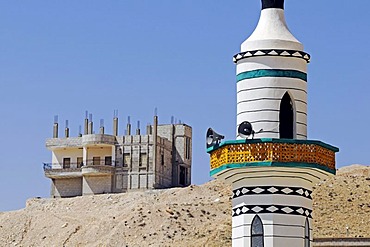 Minaret of a mosque and abandoned construction of a building in the village Djabadin near Maalula, Syria, Middle East, Asia