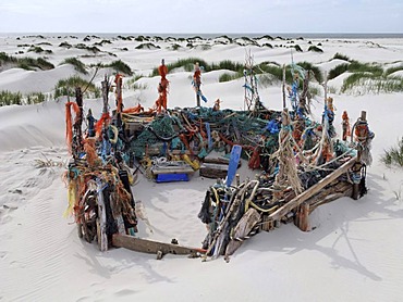 Beach castle built in sand dunes with driftwood and mmaterial washed up from the Sea between Nebel and Norddorf, Amrum Island, Schleswig-Holstein, Germany, Europe