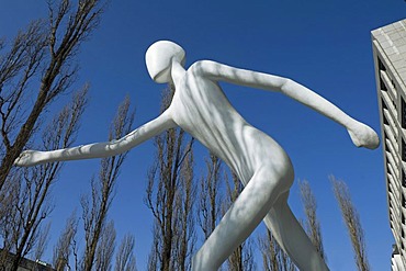 Walking man, sculpture in front of the building of the Munich Reinsurance Company, Leopold street, Munich, Bavaria, Germany, Europe