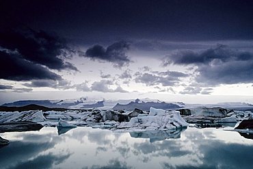 Panoramic view of a glacial lake, dramatic light ambience, Joekulsárlón at the foot of the Vatnajoekull, Iceland, Europe