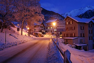 Evening in the snowy village, pass road at dusk, Berguen, Grisons, Switzerland, Europe