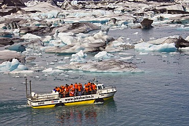 Amphibious vehicle with tourists on board on the Joekulsarlon glacial lake, Joekulsarlon, Vatnajoekull, Iceland, Europe