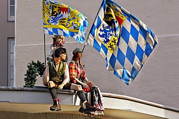 Mannequins with Bavarian flags on a roof, Munich, Bavaria, Germany, Europe