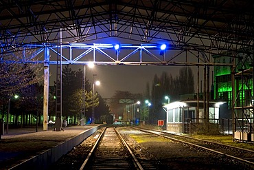 Illuminated train station in the former smelting works in the Landschaftspark Duisburg Nord landscape park, Ruhrgebiet area, North Rhine-Westphalia, Germany, Europe