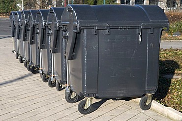 Lined up garbage containers