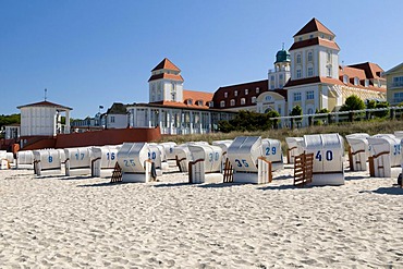 Roofed wicker beach chairs in front of Kurhaus, spa hotel in the Baltic Sea resort town of Binz, Isle of Ruegen, Mecklenburg-Western Pomerania, Germany, Europe