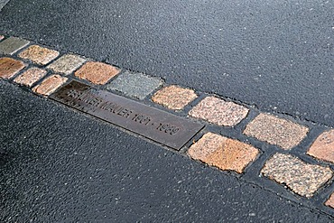 Cobble stones in the street marking the former course of the Berlin Wall, Berlin, Germany, Europe