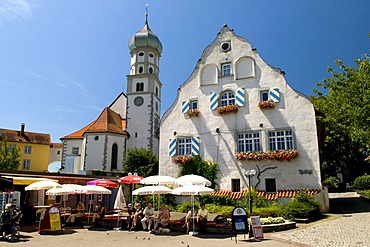 Parish church and restaurant in the Wasserburg am Bodensee village, Bavaria, Germany, Europe