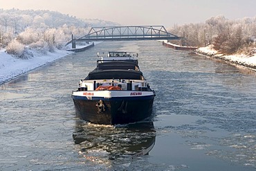 Cargo ship on the frozen Wesel-Datteln Canal, Flaesheim, Muensterland, North Rhine-Westphalia, Germany, Europe