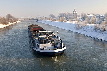 Cargo ship on the frozen Wesel-Datteln Canal, Flaesheim, Muensterland, North Rhine-Westphalia, Germany, Europe