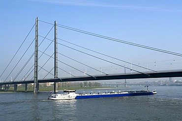 Rheinkniebruecke bridge and cargo ship, Duesseldorf, state capital of North Rhine-Westphalia, Germany, Europe