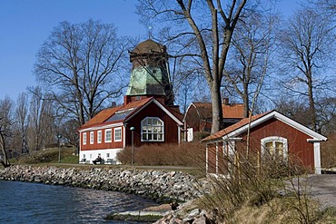 Mill and wooden house on the coast of Djurgarden at the Saltsjoen, Stockholm, Sweden, Scandinavia, Europe