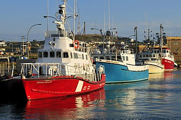 Coastguard ship and fishing boat in the harbour of Ile du Cap aux Meules, Iles de la Madeleine, Magdalen Islands, Quebec Maritime, Canada, North America