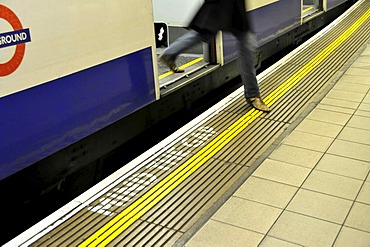 Passenger leaving the underground in the "Monument" Station, Mind the Gap, London, England, United Kingdom, Europe