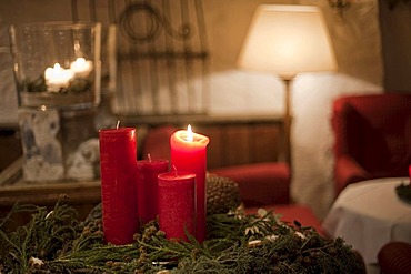 Burning candle on an advent wreath