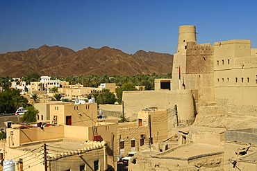 View of the city of Bahla and Bahla Fortress, UNESCO World Heritage Site, at the foot of the Jebel Akhda Highlands, Sultanate of Oman, Middle East